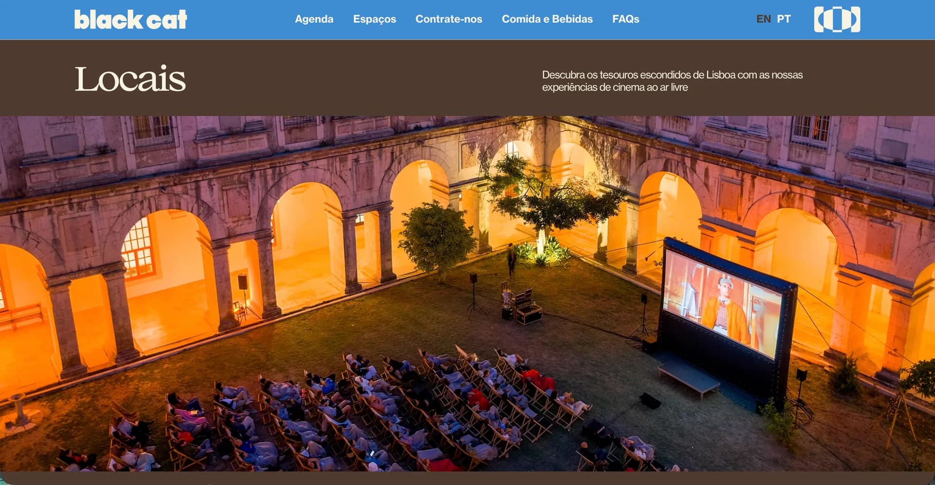 Black Cat Cinema venues page: an audience seated in a floodlit Lisbon cloister facing an open-air screen at dusk